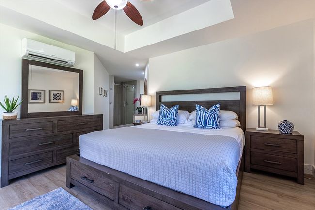 The primary bedroom has an elegant en-suite bathroom that transitions seamlessly from the sleeping a | Image 15