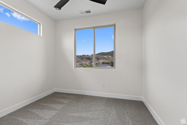 Carpeted spare room with a ceiling fan, baseboards, and visible vents | Image 30