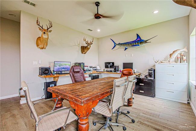 Home office with a ceiling fan, light wood-style flooring, and recessed lighting | Image 43