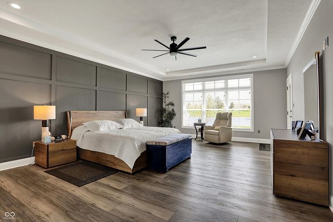 bedroom featuring crown molding, baseboards, recessed lighting, and dark wood-style flooring | Image 23