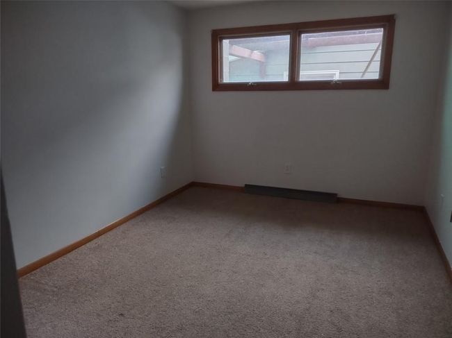 Spare room featuring carpet floors | Image 11