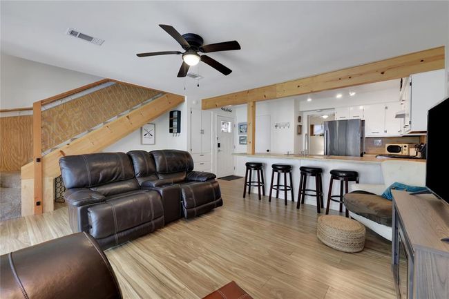 Wood look laminate flooring throughout the living area | Image 7