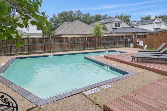 Community pool featuring a deck and a fenced backyard | Image 29