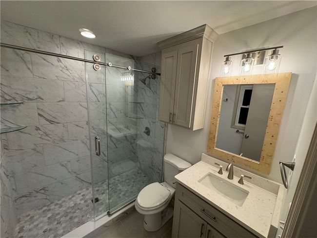Primary bath with easy step oversized shower. | Image 15