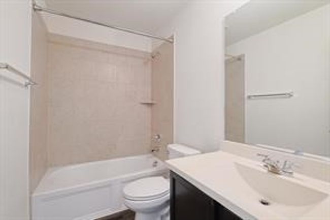 Full bathroom featuring vanity and tub / shower combination | Image 13