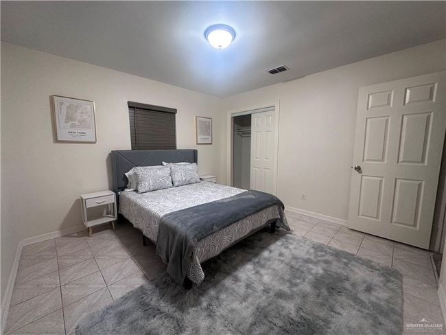Tiled bedroom featuring a closet | Image 7