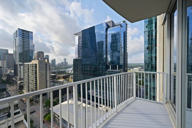 Balcony featuring a view of city | Image 15