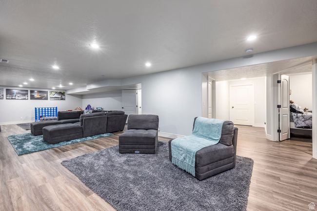 Living room featuring hardwood / wood-style floors | Image 33