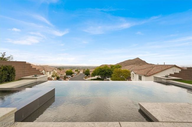 View of swimming pool featuring a mountain view | Image 55