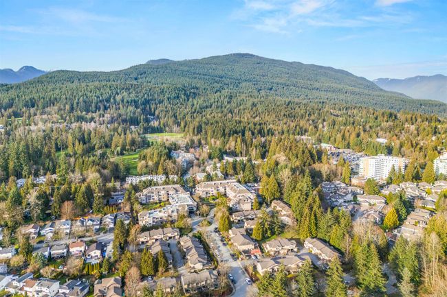 Birds eye view of property featuring a forest view and a mountain view | Image 30