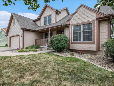 View of front of house featuring a front lawn and a garage | Image 3