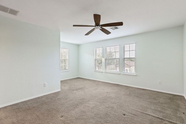 Primary Bedroom, a ceiling fan, carpet floors, and baseboards | Image 25