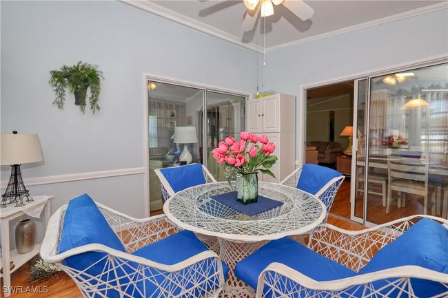 Dining room with hardwood / wood-style floors, ceiling fan, and ornamental molding | Image 23