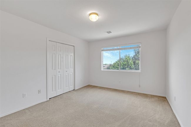 Unfurnished bedroom with carpet floors and a closet | Image 15