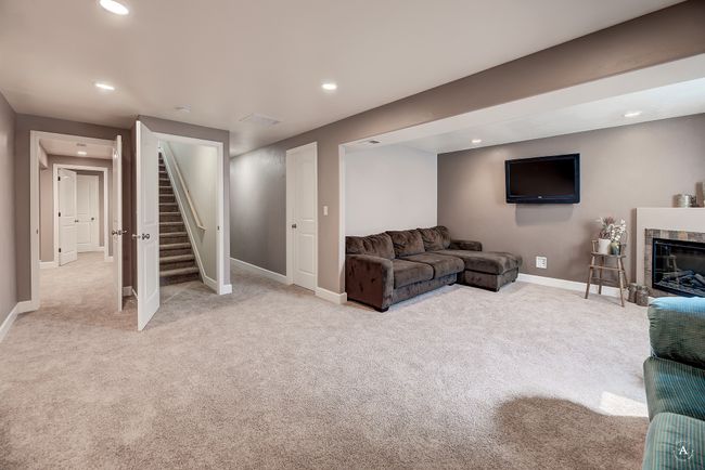 Full scape recreation/living room in basement | Image 36