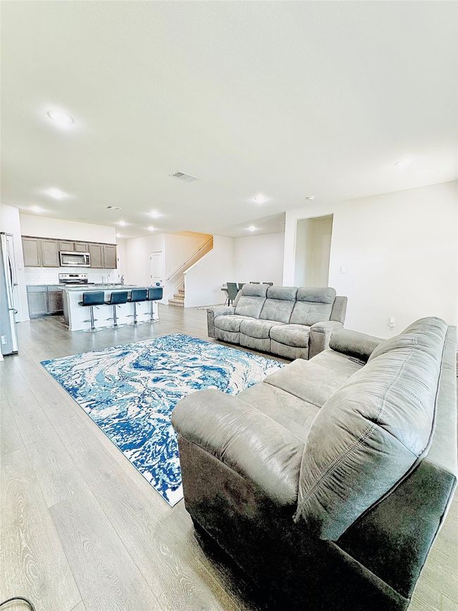 Living area with stairway, light wood finished floors, and recessed lighting | Image 12