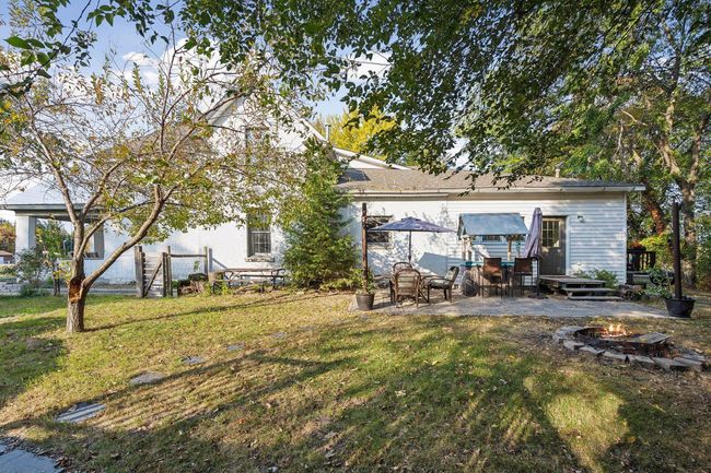 As you walk around the East side of the house, you will find a fenced-in area great for entertaining. | Image 48