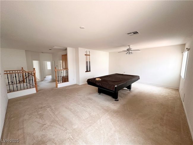 Playroom with ceiling fan, light carpet, and healthy amount of natural light | Image 20