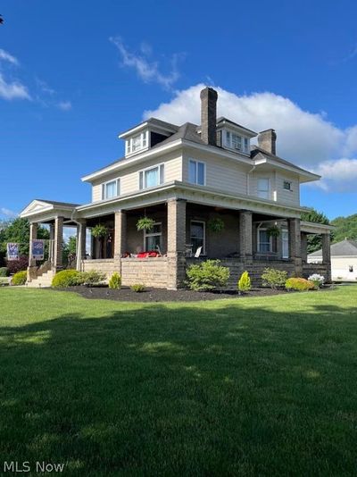 View of front of home with a porch and a front lawn | Image 2