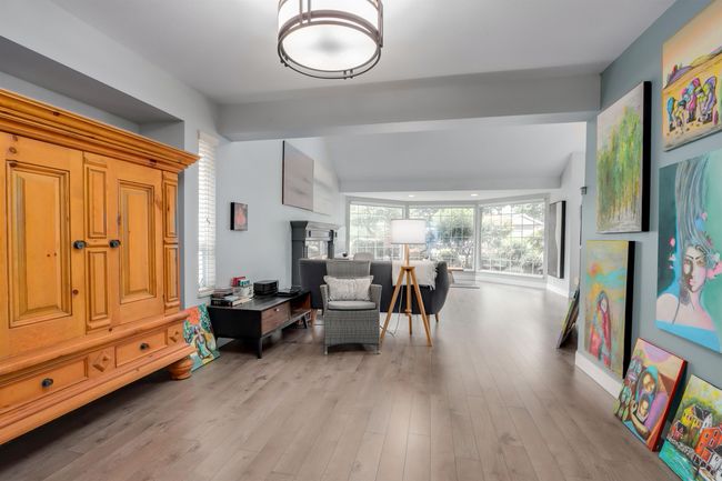 Sitting room featuring light wood-style floors | Image 7