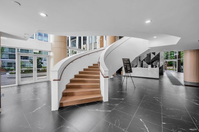Staircase featuring plenty of natural light and recessed lighting | Image 28