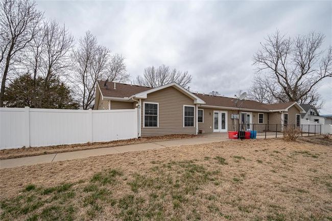 Rear view of property with a patio and fence | Image 37