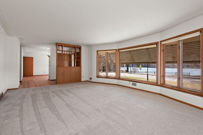 Huge Main Floor Living Room with bay window, Lake and Sunset views! | Image 48