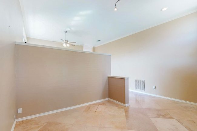 Empty room featuring crown molding, ceiling fan, visible vents, recessed lighting, and baseboards | Image 7
