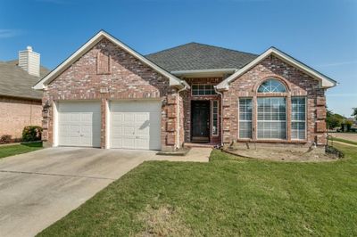 Front of property featuring a garage and a front lawn | Image 1