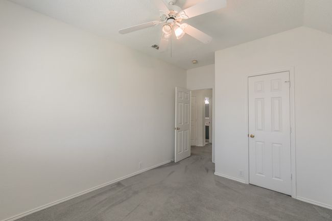 Unfurnished bedroom with visible vents, a ceiling fan, baseboards, and carpet floors | Image 16