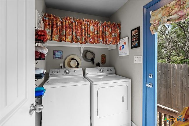 Laundry room with door going out to back yard | Image 20