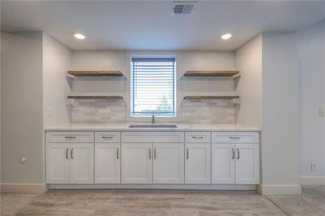 Lower level 5th bedroom ensuite with kitchenette/coffee bar. | Image 50