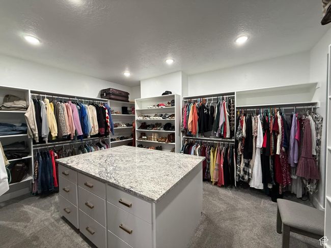 Walk in closet with carpet flooring | Image 44