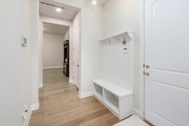 Mudroom featuring light wood-style floors and baseboards | Image 31