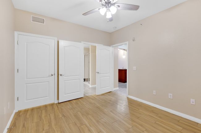2nd bedroom with ceiling fan, light wood-type flooring, and baseboards. All new paint and blinds. | Image 16