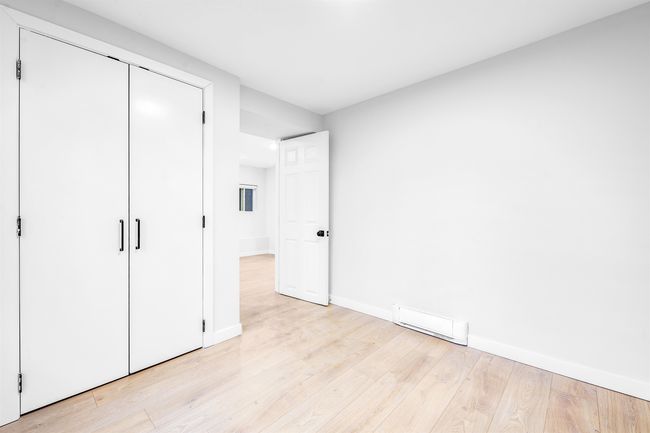 Unfurnished bedroom featuring light wood-type flooring, baseboards, visible vents, and a closet | Image 12