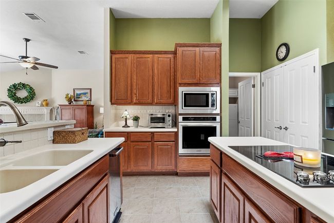 The walk-in pantry is a hidden gem, offering a spacious and convenient place to stash away everything from ingredients to small appliances | Image 13
