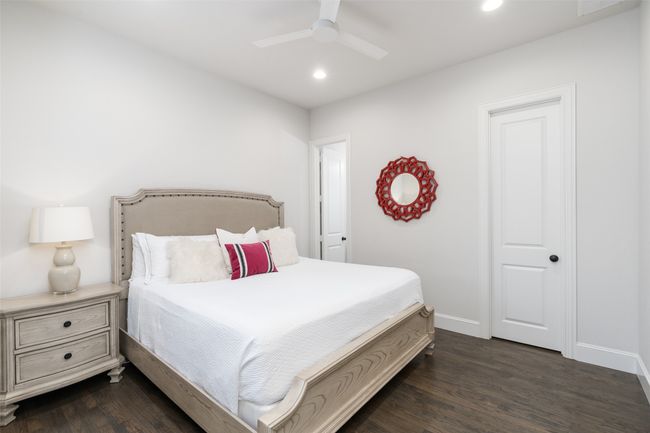 Secondary bedroom suite is located in it's own wing on the first floor with walk in closet and full bath for added privacy for your guests. | Image 22
