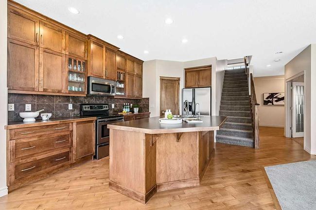 419 Cimarron Blvd, House other with 3 bedrooms, 3 bathrooms and 4 parking in Okotoks AB | Image 5