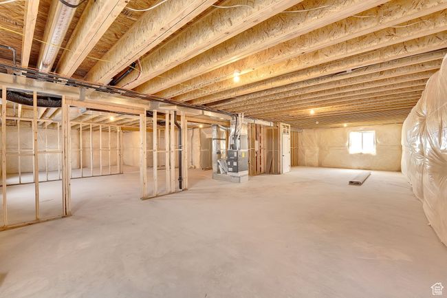 Below grade area featuring heating unit | Image 25