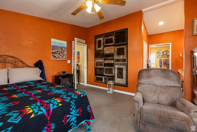 Carpeted bedroom featuring ceiling fan | Image 13