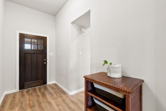 Foyer entrance featuring light wood finished floors and baseboards | Image 4