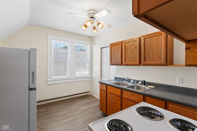 Upper Kitchen with new LVP flooring- all appliances will stay | Image 39
