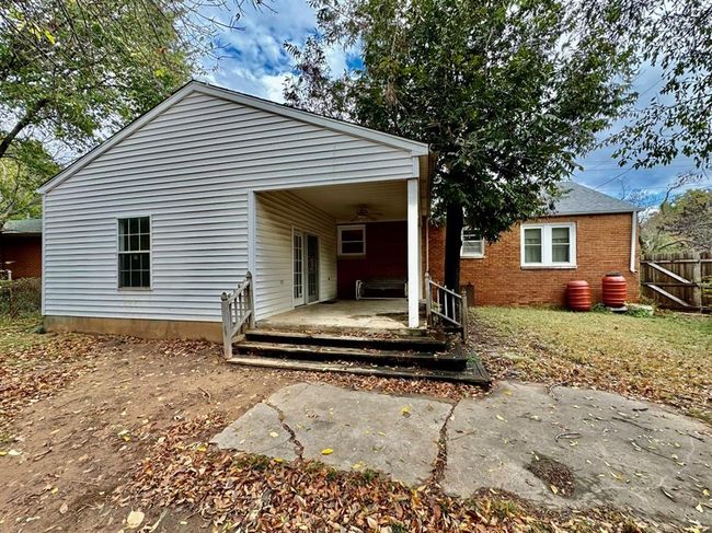Back of house with ceiling fan and brick siding | Image 26