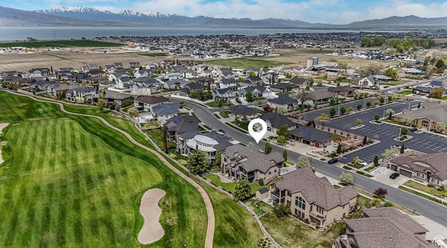 West facing Aerial view of property with a water and mountain view, golf course view, and a residential view | Image 34