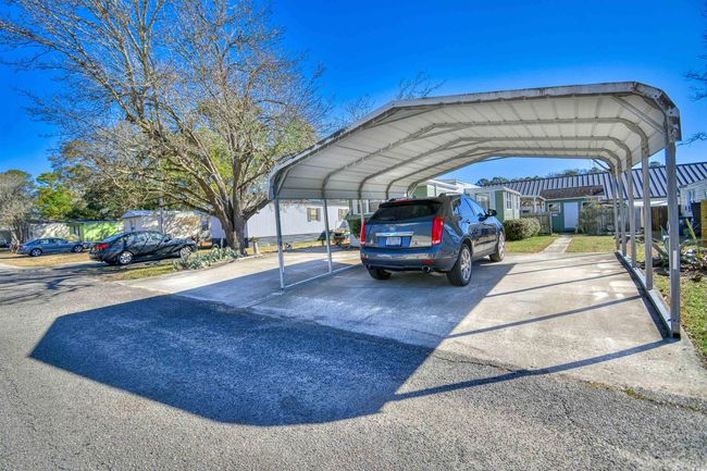 View of vehicle parking with a carport | Image 27