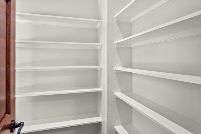 Large linen closet is spacious for storage or create a work from home nook in this space | Image 34