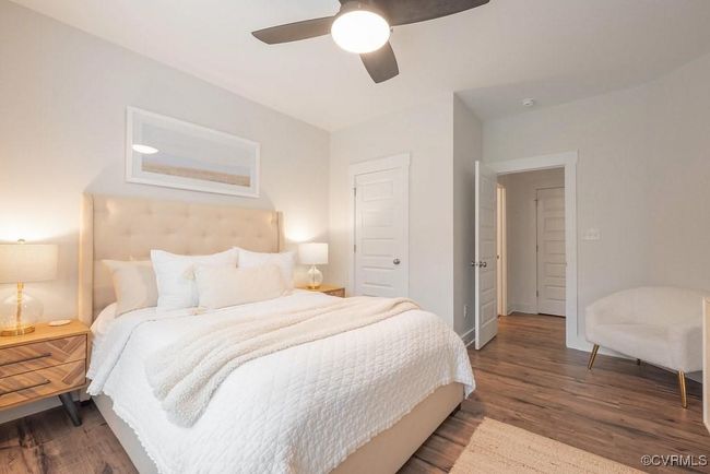 Bedroom with wood finished floors and a ceiling fan | Image 9