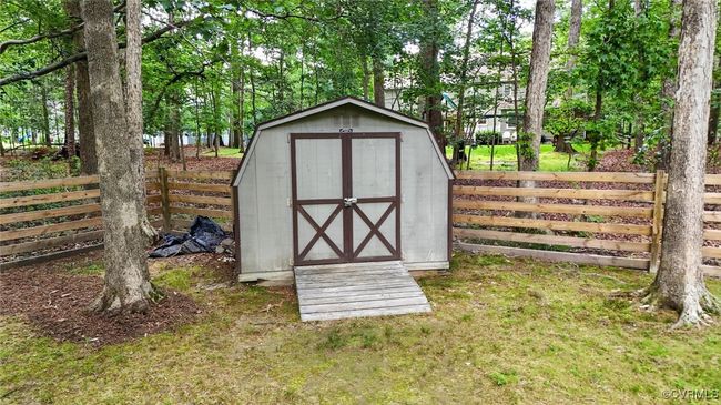 View of shed featuring a fenced backyard | Image 6