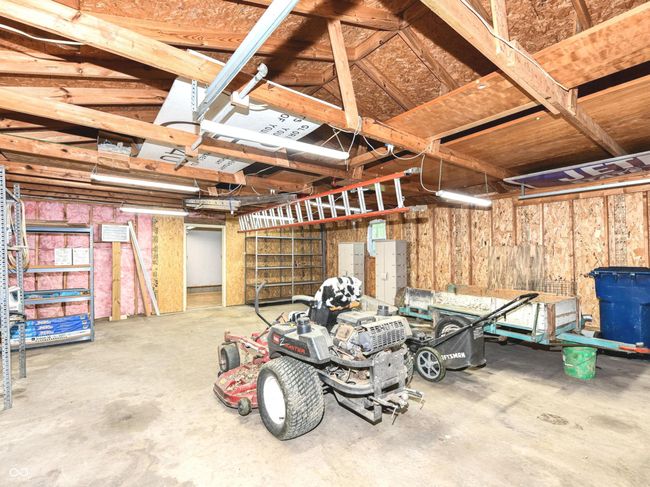 Front room is 24 x 28 with concrete floors and a 100 amp service panel. | Image 49
